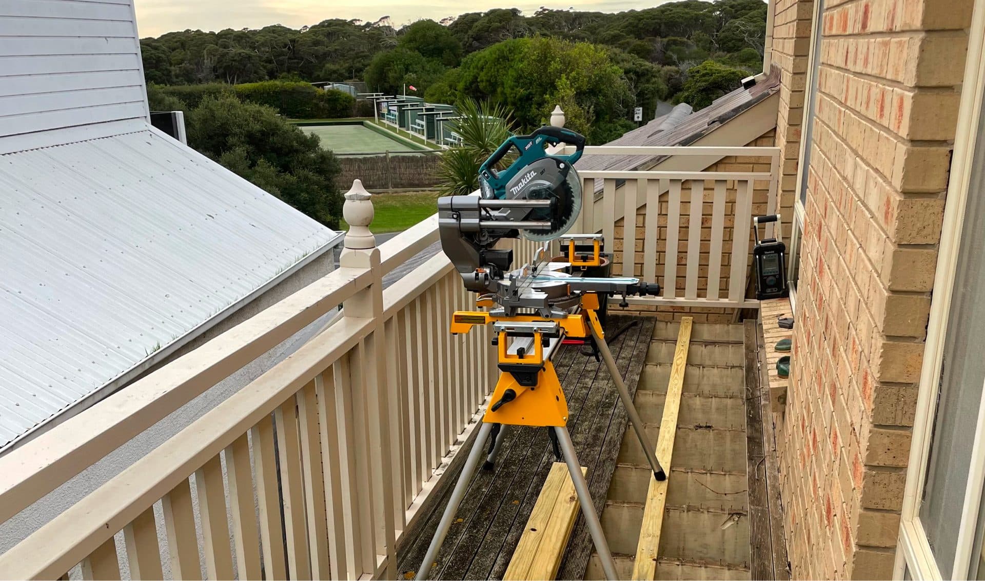 Deck boards being replaced on a first-floor balcony